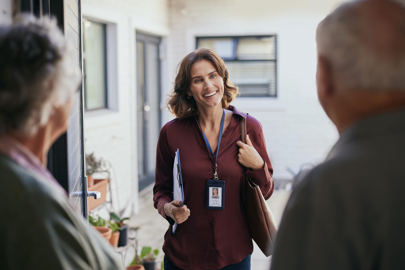 Mid adult social worker visiting an elderly couple at home